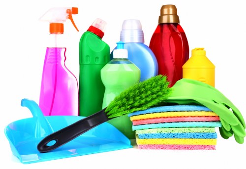 Insured carpet cleaning service working carefully around home furnishings