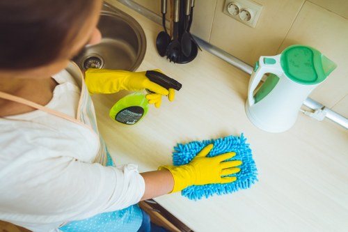 Professional carpet cleaners in Hillingdon applying safety measures on site