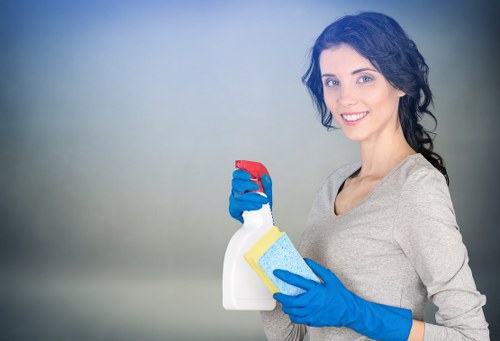 Staff member using safe cleaning procedures during a carpet cleaning job